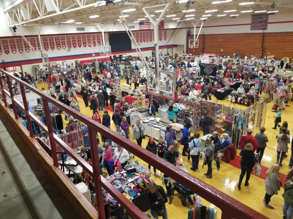 Shoppers browsing vendor booths at the Fall Craft Fair